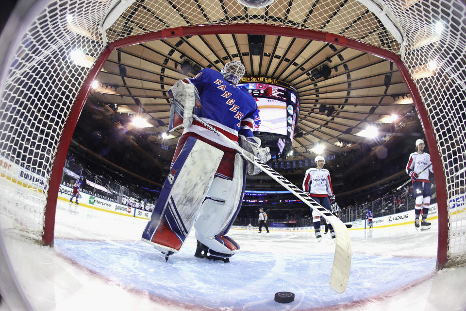 New York Rangers' Alexandar Georgiev takes the puck from the net following a second-period goal by Washington Capitals' T.J. Oshie (77) during an NHL hockey game Wednesday, May 5, 2021, in New York. (Bruce Bennett/Pool Photo via AP)