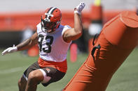 Cleveland Browns defensive linemen Tommy Togiai (93) participates in a drill during an NFL football practice at the team's training facility, Thursday, June 17, 2021, in Berea, Ohio. (AP Photo/David Dermer)