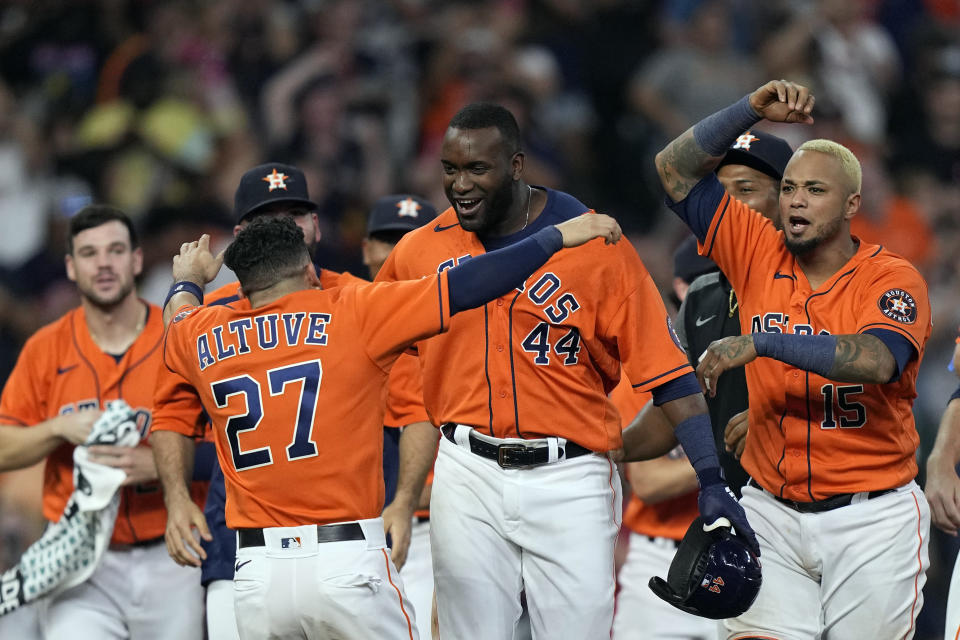 Houston Astros' Yordan Alvarez (44) celebrates with Jose Altuve (27) after hitting a game-winning RBI-double against the Chicago White Sox during the ninth inning of a baseball game Friday, June 18, 2021, in Houston. The Astros won 2-1.(AP Photo/David J. Phillip)