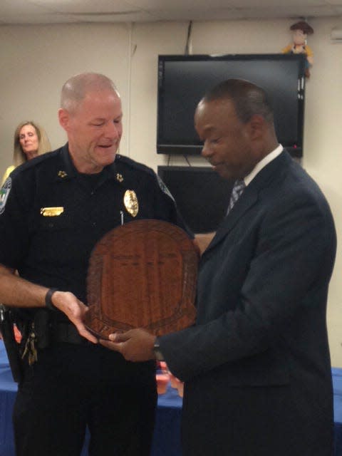 Knoxville Police Department Chief David Rausch, left, presents a plaque to Deputy Chief Nate Allen on Friday, May 20, 2016, at the Safety Building. Allen, the department's first black deputy chief, retired from KPD and has accepted a job as chief of police in Decatur, Ala. KPD, meanwhile, has placed an emphasis on both recruiting and promoting more minority officers within the department.