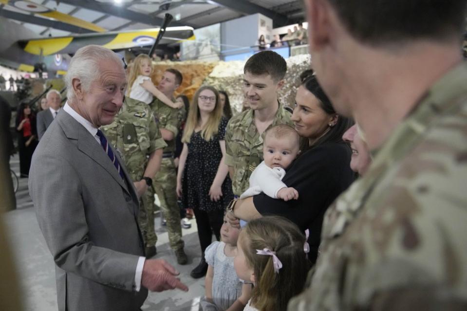 King Charles III meets staff members and their families at an army base in Middle Wallop, England, on May 13, 2024. Kin Cheung/WPA Pool/Shutterstock