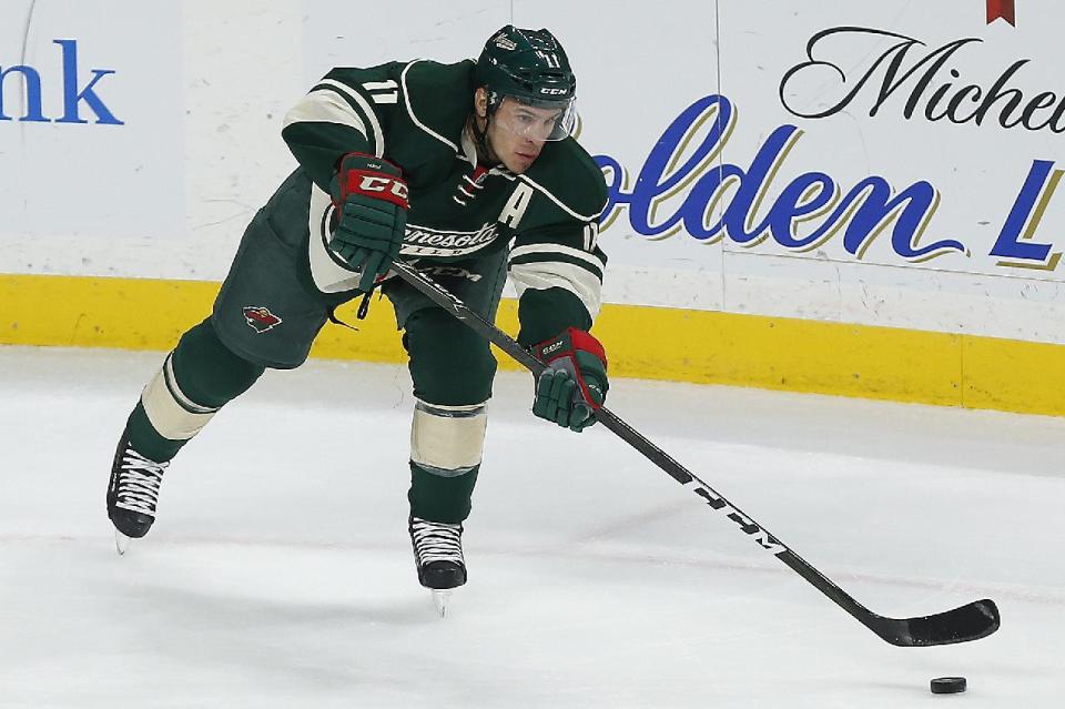 This Nov. 25, 2016 photo shows Minnesota Wild's Zach Parise controlling the puck against the Pittsburgh Penguins in the first period of an NHL hockey game in St. Paul, Minn. Minnesota Wild forwards Zach Parise and Jason Pominville have been diagnosed with mumps and must miss at least three games. The Wild announced Monday, Feb. 27, 2017 shortly before faceoff against Los Angeles, that Parise and Pominville have the highly contagious virus along with other members of the organization. (AP Photo/Stacy Bengs)