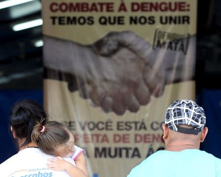 Patients with suspected dengue symptoms wait to see doctors in a medical tent in Rio Claro, Brazil March 5, 2015. REUTERS/Paulo Whitaker