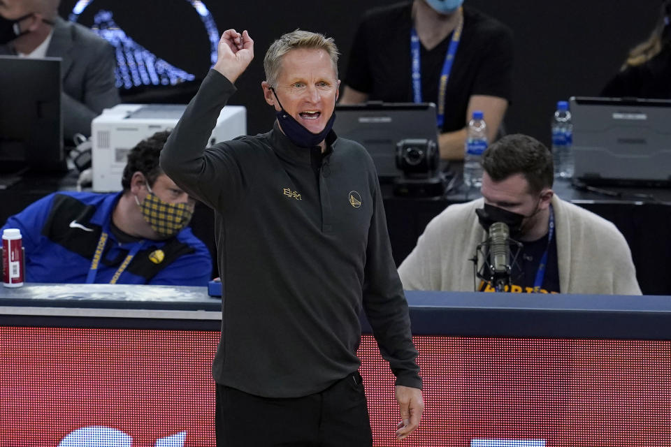 Golden State Warriors coach Steve Kerr gestures to players during the first half of the team's NBA basketball game against the Boston Celtics in San Francisco, Tuesday, Feb. 2, 2021. (AP Photo/Jeff Chiu)