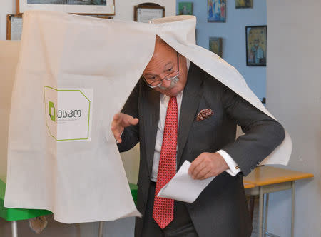 Grigol Vashadze, presidential candidate from the opposition United National Movement, leaves a voting booth at a polling station during presidential election in Kutaisi, Georgia October 28, 2018. REUTERS/Tornike Turabelidze