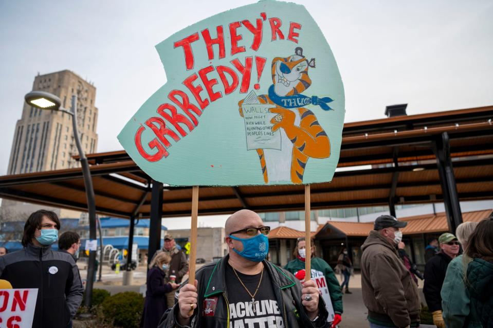 Hundreds gather to see Sen. Bernie Sanders on Friday, Dec. 17, 2021, at a rally to support striking workers outside Kellogg Co. World Headquarters in Battle Creek, Michigan.