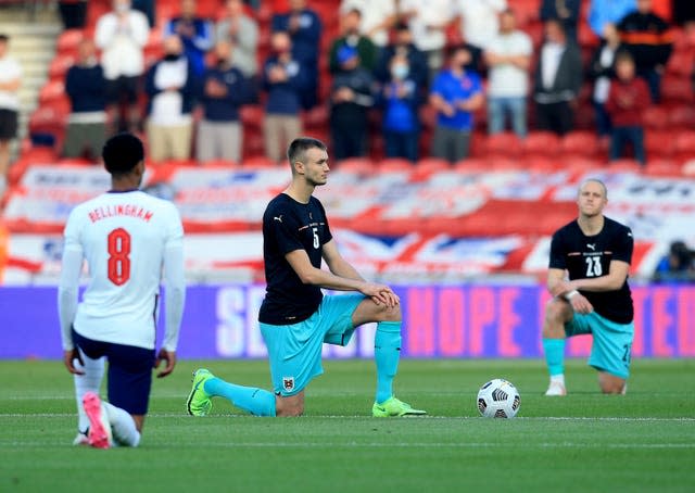 England and Austria players take a knee at the Riverside on Wednesday (Lindsey Parnaby/PA).