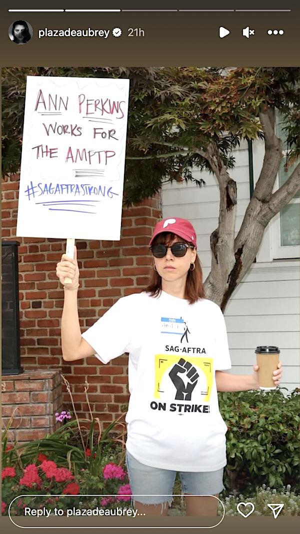 aubrey holding up a sign