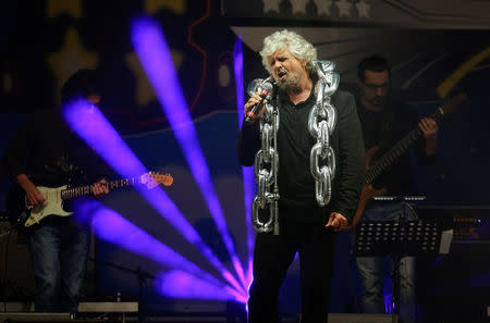 5-Star movement founder Beppe Grillo sings during a gathering in Rimini, Italy, September 23, 2017. REUTERS/Max Rossi