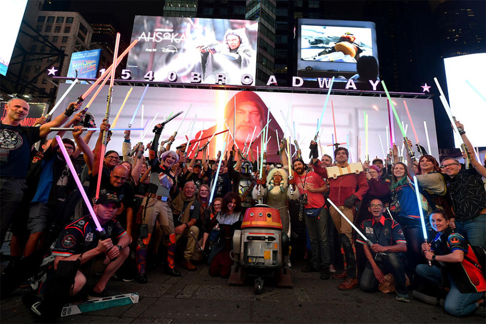 Fans gather in front of a billboard in Times Square during the Ahsoka Fan Event on August 17, 2023 in New York City.