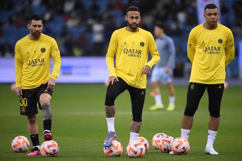 Lionel Messi, Neymar and Kylian Mbappe warm up for PSG (AFP via Getty Images)