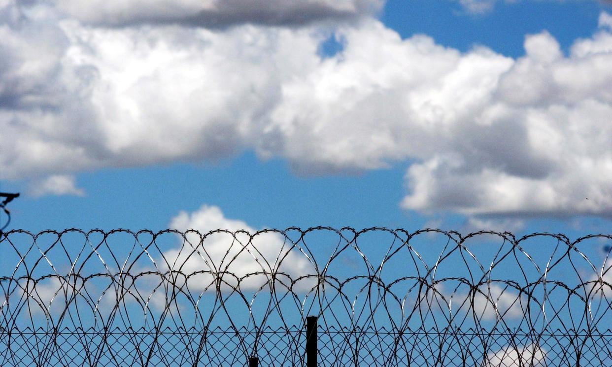 <span>A report by Queensland’s Child Death Review Board details the case of two disabled First Nations children who died after spending extensive time in isolation at youth detention centres.</span><span>Photograph: Dave Hunt/AAP</span>