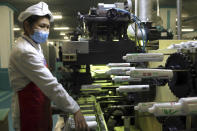 An employees of Pyongyang Dental Hygiene Products Factory produces toothpaste for citizens as the state increased measures to stop the spread of illness in Pyongyang, North Korea Monday, May 16, 2022. (AP Photo/Cha Song Ho)