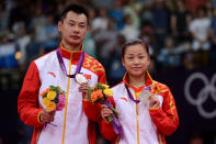 LONDON, ENGLAND - AUGUST 03: Silver medallists Chen Xu and Jin Ma of China hold their medals in the Mixed Doubles Badminton medal ceremony on Day 7 of the London 2012 Olympic Games at Wembley Arena on August 3, 2012 in London, England. (Photo by Michael Regan/Getty Images)