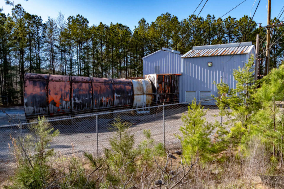 Large machinery behind a fence