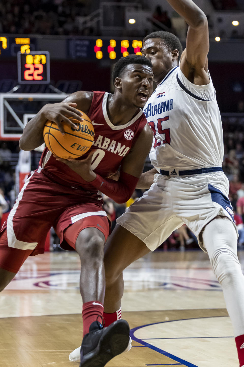 Alabama guard Jaden Bradley (0) works inside against South Alabama forward Judah Brown (25) during the first half of an NCAA college basketball game, Tuesday, Nov. 15, 2022, in Mobile, Ala. (AP Photo/Vasha Hunt)