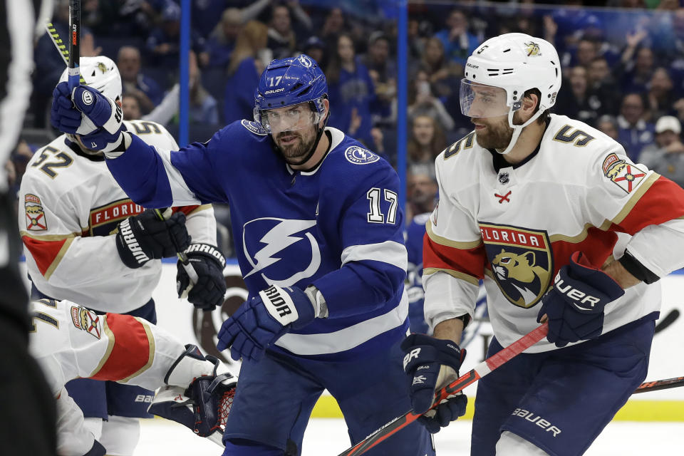 Tampa Bay Lightning left wing Alex Killorn (17) celebrates his goal against the Florida Panthers during the second period of an NHL hockey game Monday, Dec. 23, 2019, in Tampa, Fla. Defending for the Panthers is Aaron Ekblad (5). (AP Photo/Chris O'Meara)