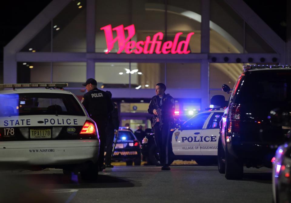 Police secure the area after reports that a gunman fired shots at the Garden State Plaza mall in Paramus, New Jersey, November 4, 2013. A person with a gun opened fire on Monday evening in the New Jersey shopping mall shortly before closing time in the town of Paramus, and the mall was being evacuated, a county official said. (REUTERS/Ray Stubblebine)