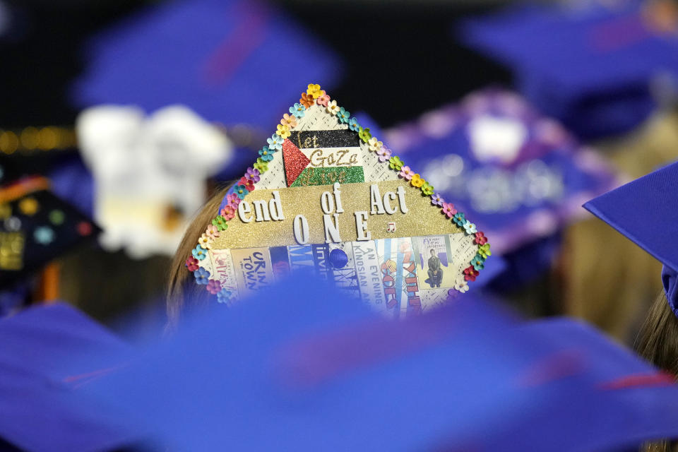 A student wears a Palestinian flag decoration on a graduation mortarboard as first lady Jill Biden speaks at the Mesa Community College commencement Saturday, May 11, 2024, in Tempe, Ariz. (AP Photo/Ross D. Franklin)