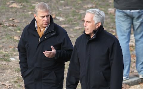 Prince Andrew smiling as he stands with his left arm around the waist of Virginia Roberts. It is alleged to have been taken in early 2001. Ghislaine Maxwell stands behind. - Credit: Jae Donnelly&nbsp;