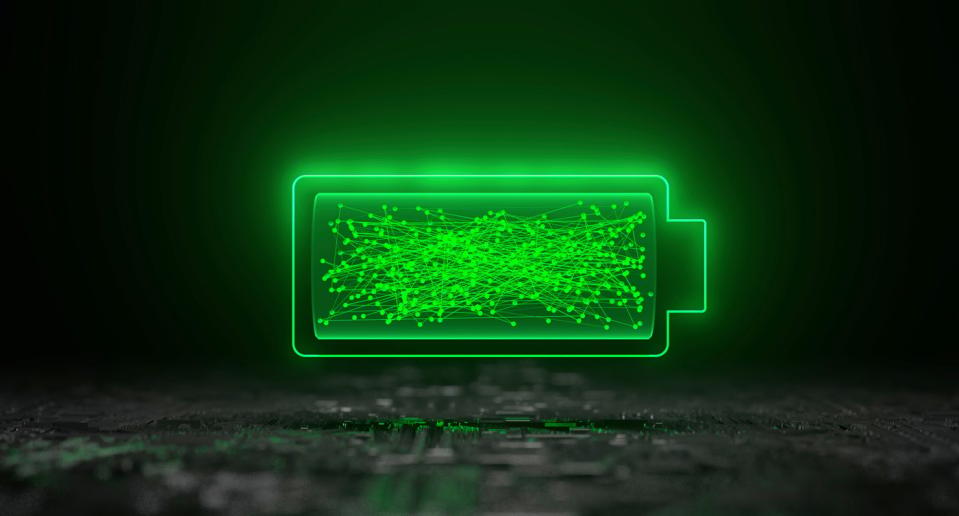 Outline and inside of a battery lit up with glowing green light. 