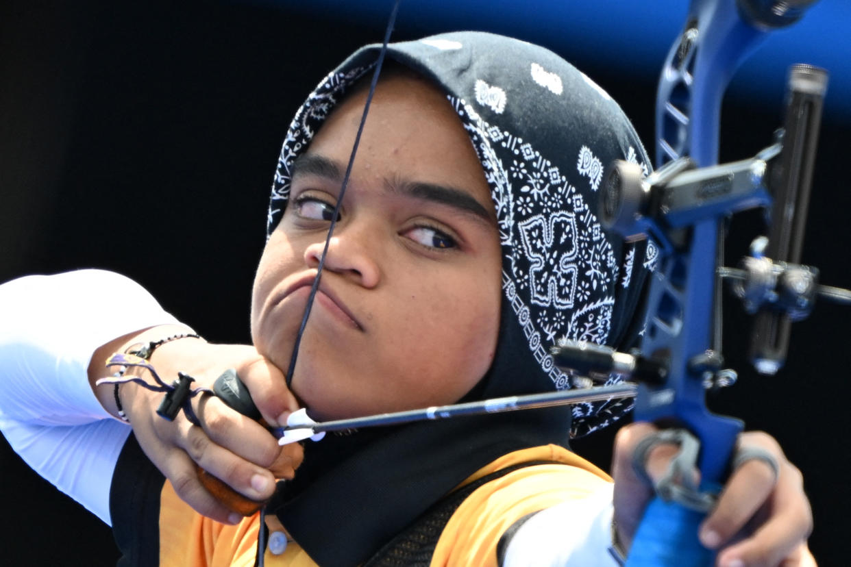 Malaysia's Ariana Nur Dania Mohamad Zairi competes in the archery women's individual elimination round during the Paris 2024 Olympic Games at the Esplanade des Invalides in Paris on July 31, 2024. (Punit Paranjpe/AFP via Getty Images