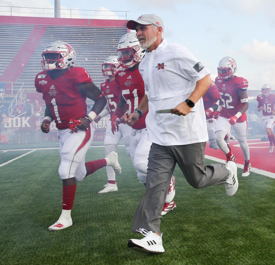 Nicholls coach Tim Rebowe and the Colonels take the field before a Football Championship Subdivision first round playoff game against North Dakota from John L. Guidry Stadium in Thibodaux last year.