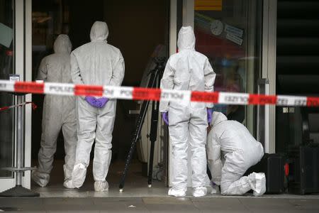 Police investigators work at the crime scene after a knife attack in a supermarket in Hamburg, Germany, July 28, 2017. REUTERS/Morris Mac Matzen