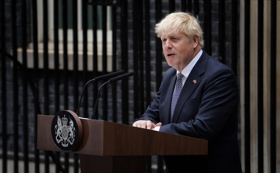 Prime Minister Boris Johnson, watched by wife Carrie Johnson (centre holding daughter Romy), reads a statement outside 10 Downing Street, London, formally resigning as Conservative Party leader after ministers and MPs made clear his position was untenable. He will remain as Prime Minister until a successor is in place. Picture date: Thursday July 7, 2022.