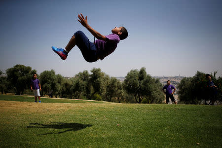 Palestinian youth play in a park in Jerusalem May 11, 2017. Picture taken May 11, 2017. REUTERS/Amir Cohen