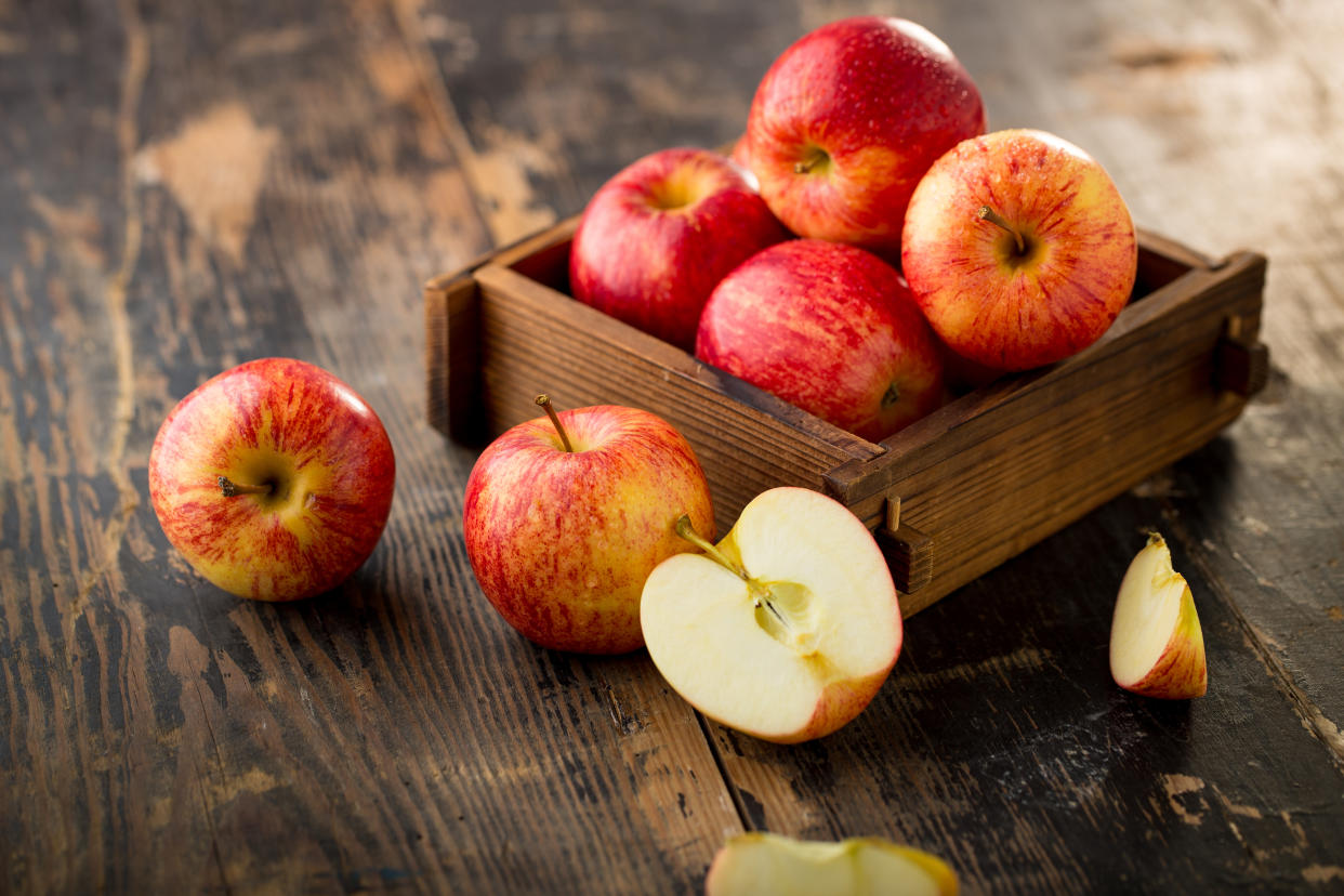 apple isolated on wood background