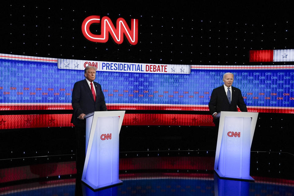 President Joe Biden, right, and Republican presidential candidate former President Donald Trump, left, stand during break in a presidential debate hosted by CNN, Thursday, June 27, 2024, in Atlanta. (AP Photo/John Bazemore)