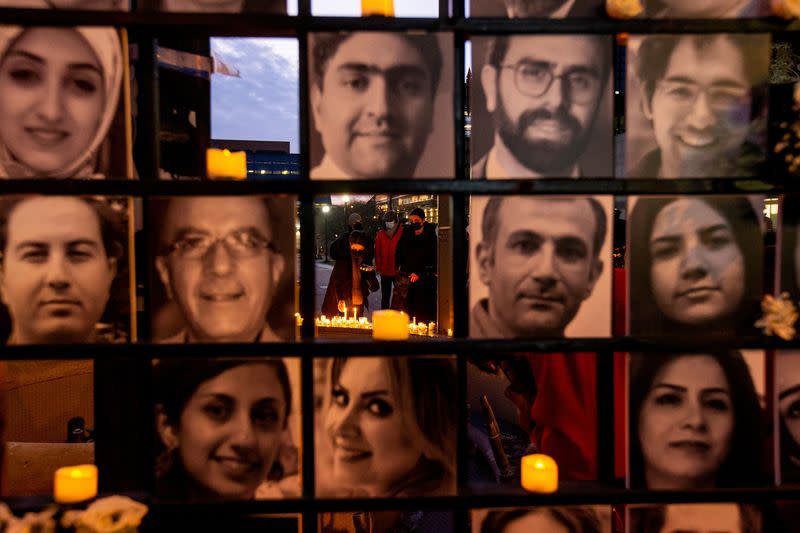 Mourners attend an outdoor vigil for the victims of Ukrainian passenger jet flight PS752 in Toronto