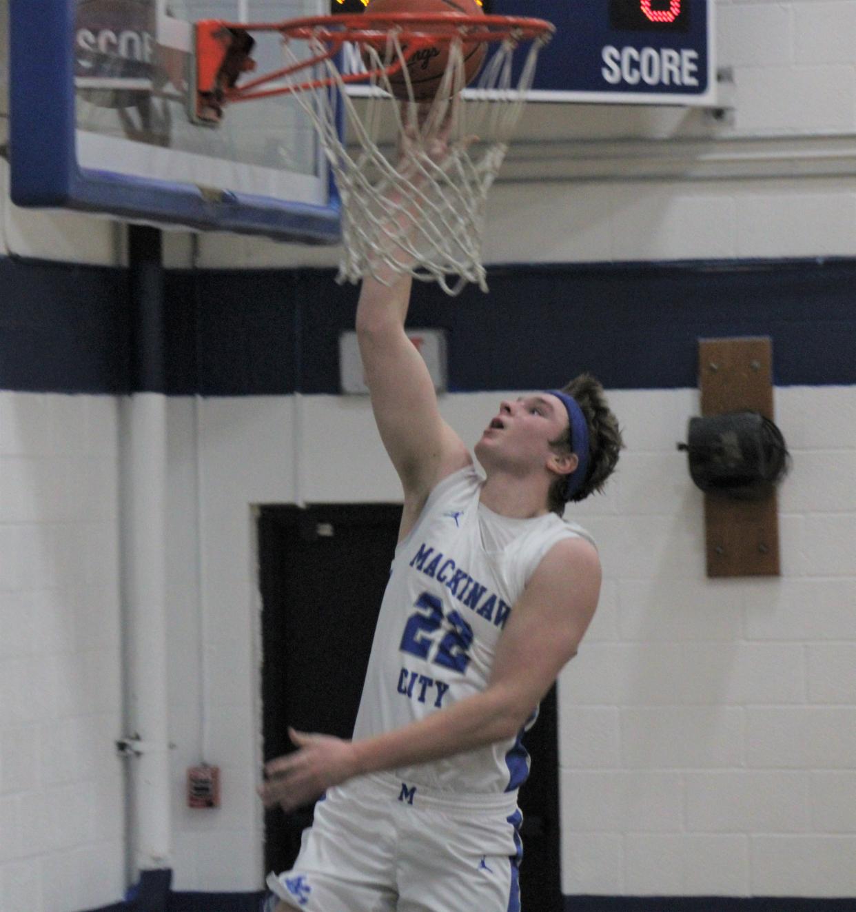 Mackinaw City senior center Lucas Bergstrom makes a layup during a recent game against Boyne Falls. After a breakout junior campaign, Bergstrom is thriving with the Comets as a senior.