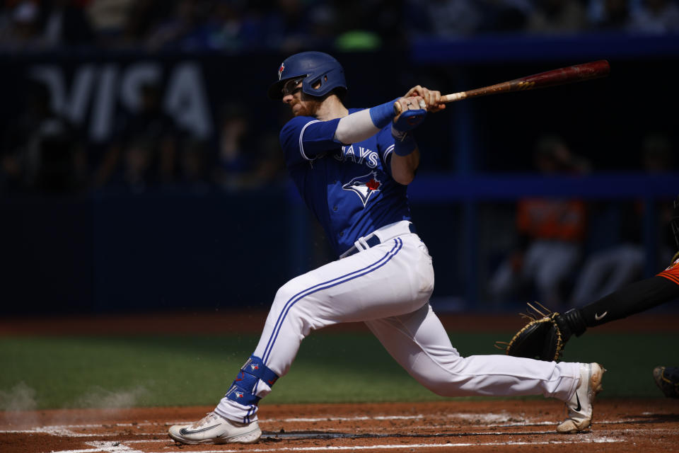 Toronto Blue Jays' Danny Jansen swings during second-inning baseball game action against the Baltimore Orioles in Toronto, Ontario, Saturday, May 20, 2023. (Cole Burston/The Canadian Press via AP)