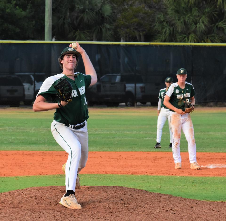 Jupiter pitcher Ethan Trivison warms up on the mound before an inning starts against Benjamin on April 22, 2024.