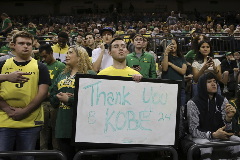 University of Oregon student Isaiah Champagne and The Pit Crew pay tribute to Kobe Bryant during the UCLA Oregon NCAA basketball game in Eugene, Ore., Sunday, Jan. 26, 2020. (AP Photo/Chris Pietsch)