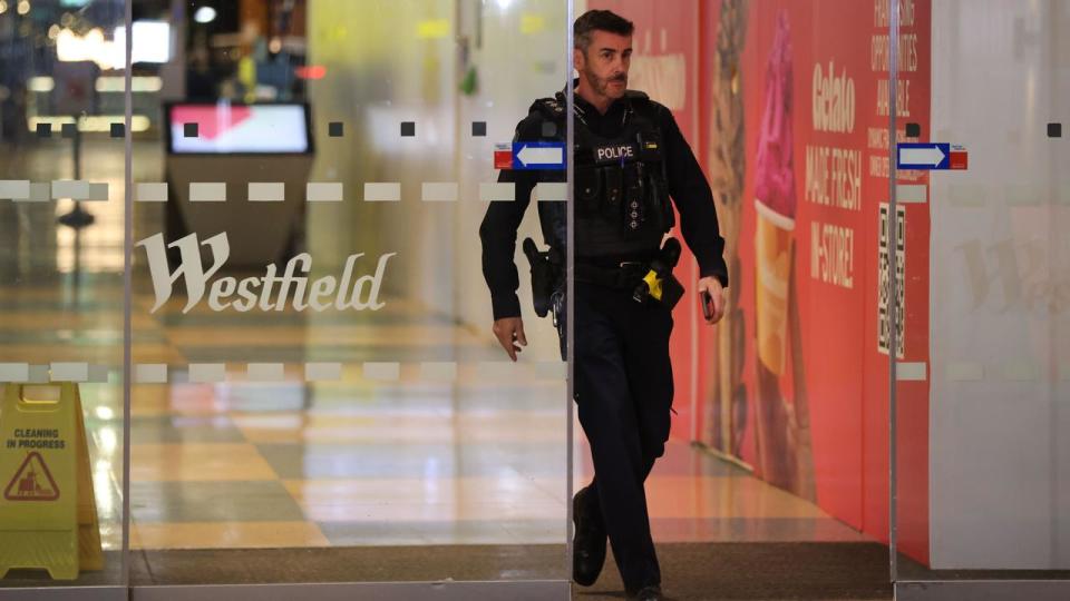 Police are seen at Westfield Marion Shopping Centre