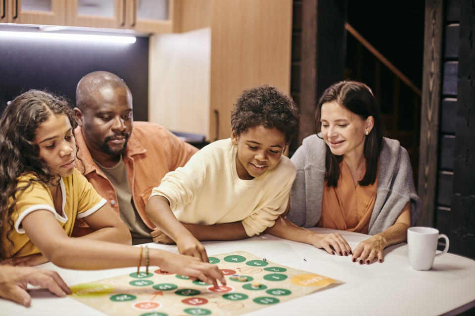 Family playing a board game