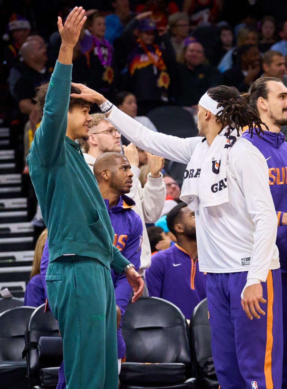 Dec 20, 2022; Phoenix, AZ, USA; Phoenix Suns Damion Lee pats Cameron Johnson on the head as they react to a three-pointer against the Washington Wizards at Footprint Center on Tuesday, Dec. 20, 2022. Mandatory Credit: Alex Gould/The Republic