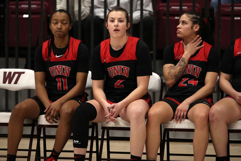 December 12, 2021; Canyon, Texas, USA; UNLV Lady Rebels Kenadee Winfrey (2) from Canyon, Texas on the bench during the game agains the Texas Tech Lady Raiders at the First United Bank Center.  Credit: Michael C. Johnson for A-J Media