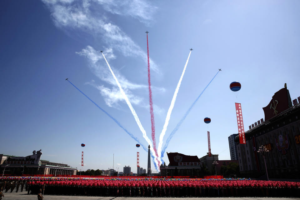 Airplanes with trails of colored smoke perform during a parade for the 70th anniversary of North Korea's founding day in Pyongyang, North Korea, Sunday, Sept. 9, 2018. North Korea staged a major military parade, huge rallies and will revive its iconic mass games on Sunday to mark its 70th anniversary as a nation. (AP Photo/Kin Cheung)