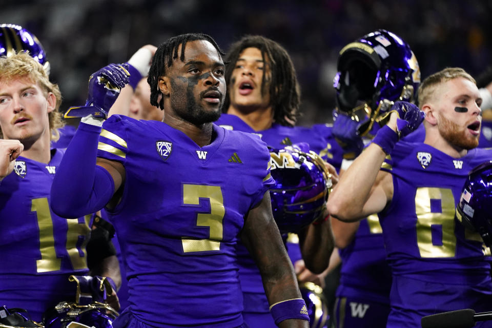 Washington safety Mishael Powell (3) sings with teammates as they celebrate a 15-7 win over Arizona State in an NCAA college football game Saturday, Oct. 21, 2023, in Seattle. Powell returned an interception for a touchdown in the second half. (AP Photo/Lindsey Wasson)