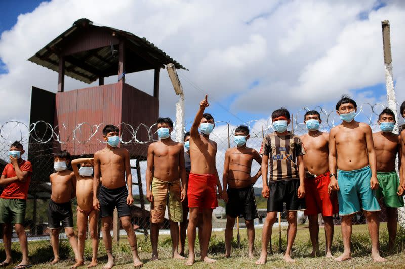 Indigenous people from Yanomami ethnic group are seen at the 4th Surucucu Special Frontier Platoon of the Brazilian army in the municipality of Alto Alegre