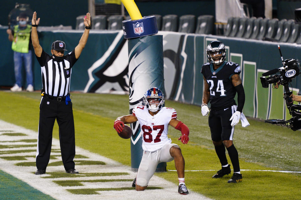 New York Giants wide receiver Sterling Shepard (87) celebrates after scoring a touchdown against Philadelphia Eagles' Darius Slay (24) during the second half of an NFL football game, Thursday, Oct. 22, 2020, in Philadelphia. (AP Photo/Chris Szagola)