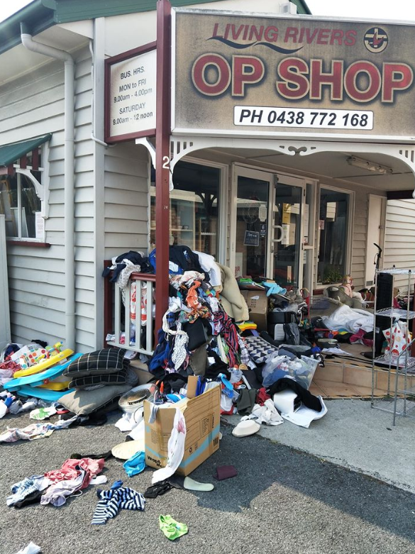 Pictured is clothing, shoes and toys strewn in front of the Living Rivers Uniting Church Op Shop on the Gold Coast. Source: Facebook