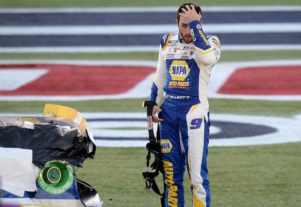 NASCAR driver Chase Elliott rubs his forehead after climbing from his car to see the damage sustained from a wreck with driver Kevin Harvick during the Bank of America Roval 400 at Charlotte Motor Speedway in Concord, NC on Sunday, October 10, 2021.