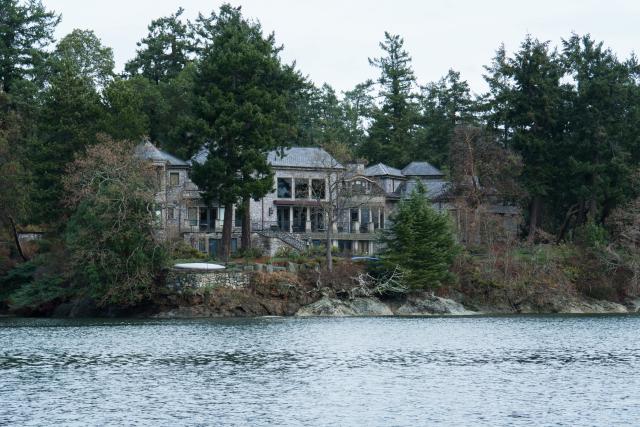 The residence of Prince Harry and and his wife Meghan is seen in Deep Cove Neighborhood  from a boat on the Saanich Inlet, North Saanich, British Columbia on January 21, 2020. - The new neighbors have been spotted out hiking and down at the farmers' market, but residents of North Saanich say they will ensure privacy for Harry and Meghan at their Canadian island hideaway. The Duke and Duchess of Sussex, along with their baby son Archie, are living at the scenic, wooded property of Mille Fleurs on Vancouver Island after exiting from their royal roles. (Photo by Mark GOODNOW / AFP) (Photo by MARK GOODNOW/AFP via Getty Images)