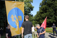 Protesters display posters in support of the independent broadcaster TVN during a demonstration in Warsaw, Poland, Tuesday, Aug. 10, 2021. Larger nationwide demonstrations are planned across Poland later on Tuesday against a bill widely viewed as a effort by the country's ruling nationalist party to silence an independent, U.S.-owned, television broadcaster critical of the government. TVN is owned by Discovery Inc. (AP Photo/Czarek Sokolowski)