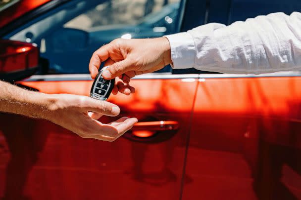 STOCK PHOTO: Dealer Giving Car Keys To The New Owner (STOCK PHOTO: Diana Vyshniakova / Eyeem/Getty Images/EyeEm)